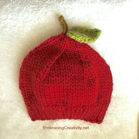 This post contains affiliate links. Today is the second day of our 31 Days of Knitted Gifts!  To see our previous project, go here.  This little apple hat is adorable for newborn photos or family f… Knitted Crafts, Knitted Gifts, Apple Hat, Baby Apple, Knitting Hat, Baby Hats Knitting, 31 Days, Second Day, Tiny Hand