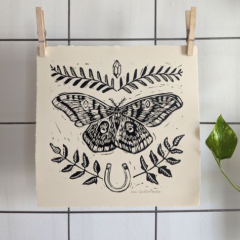 "\"luck moth\"  handprinted linocut blockprint on by Sara Schalliol-Hodge Features a polyphemus moth, quartz crystal, 2 fern varieties, and a horseshoe. -paper measures 11\" x 11\" -image measures 9\" x 9\" -handprinted with oil-based blockprinting ink -Arches cream 100% cotton fiber paper, acid-free, pH neutral Each piece is printed by hand and therefore unique. There will be subtle variations in each print and the print you receive may vary slightly from the print pictured. This is part of what makes hand printed art so special." Polyphemus Moth, Moth Linocut, Insect Linocut, Woodcut Moth Tattoo, Insect Block Print, Black And White Moth Art, Moth Block Print, Moth Art Print, Henna Drawings