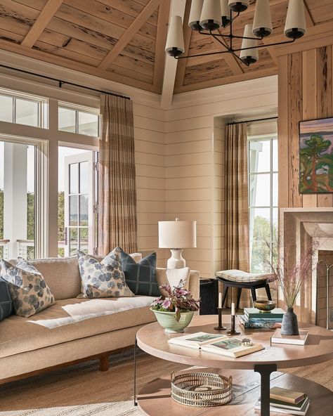 Warm woods, natural elements, and our Geraniums pillows help create a welcoming feeling in this living room @interiorsbyherlong. 🌿 Photo by @mb_productions_nc #RAfabricbytheyard #RApillows #rebecca_atwood #RAatHome #RAdesignerstories #inspiresRA Limestone Fireplace Surround, Pecky Cypress, White Shiplap Wall, Limestone Fireplace, Outside Living, Neutral Living Room, Architecture Interiors, Waterfront Homes, Updating House