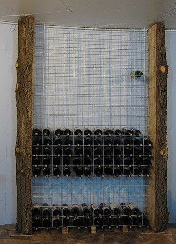 A cheap solution to the wine rack problem, so long as you have a spare pine tree, a chain saw, some fencing staples, a bit of time, and a place that suits.  The steel mesh was the only bit I had to buy - I think it was about $25 for each of the two sheets.  The rack will hold 240 bottles. Wire Wine Rack, Wine Rack Projects, Modern Wine Rack, Wine Rack Design, Oven Cabinet, Wine Cellar Design, Cellar Design, Wine Shelves, Wine Rack Wall