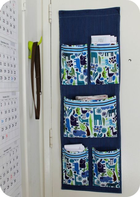 DiY Project: Sew a Fabric Mail Organizer for the Wall | theleftcoastmama - cute fabric for a kid's room - bed pocket organizer.  I like the pleats in the pockets on this one. Diy Mail Organizer, Floor Printable, Diy Mail, Wand Organizer, Organize Fabric, Pocket Organizer, Mail Organizer, Hanging Organizer, Sewing Organization