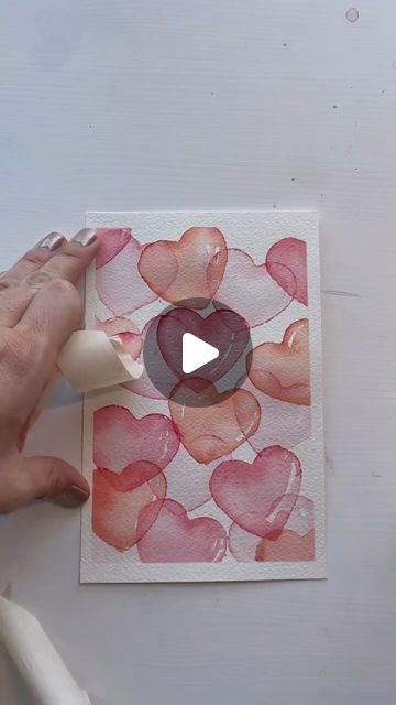 Winsor & Newton on Instagram: "Save and try out this love heart tutorial by artist @manajoypaperco 👇 using our Cotman Watercolour Studio Set of 45 Half Pan 

Step 1: Dip the cookie cutter in the paint or use your brush to spread the paint on the cutter

Step 2: Rinse your brush and use clean brush to paint inside the heart

♥️ Make sure the first hearts are completely dry

Step 3: Stamp a little darker pink paint

Step 4: After the second hearts are dry, add yellow to the darker pink and make peach colour hearts

♥️ Make sure you leave white spaces on the hearts

♥️ before you take off the tape, make sure the paint is completely dry

#painttutorial #watercolourartist #watercolor #watercolour #hearts #watercolourtutorial #paintstepbystep #heartdrawing" Canvas Painting Ideas For Love, Water Colour Painting Watercolour, Watercolor Tutorial Step By Step, Pottery Engobe, Watercolour Hearts, Watercolour Heart, Card Maps, Heart Canvas Art, Heart Tutorial