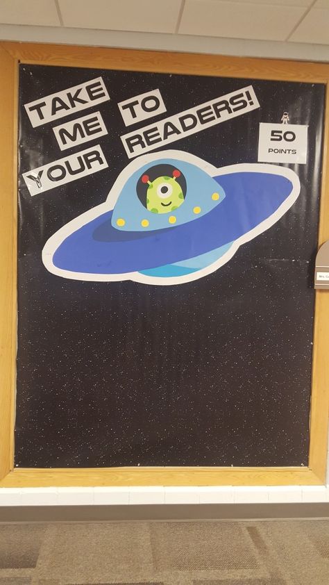 Space Week Classroom Decor, Outer Space Classroom Door Ideas, Outer Space School Theme Bulletin Boards, Aliens Classroom Theme, Space Themed Family Literacy Night, Space Theme Elementary School, Alien Door Decorations Classroom, Space Theme For School, Space Library Theme