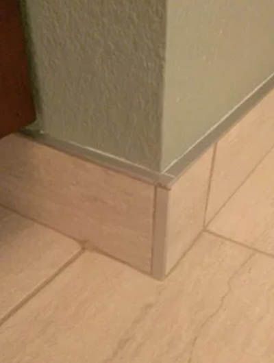 Tile Edge Trim Ideas | Sebring Design Build Wall Edging Ideas, Bathroom Floor Trim Ideas, Bathroom Floor Trim, Bathroom Tile Trim Ideas, Tile Baseboard Ideas, Tile Edging Trim Ideas Bathroom, Bathroom Tile Baseboard, Tile Trim In Bathroom, Tile Baseboard Bathroom