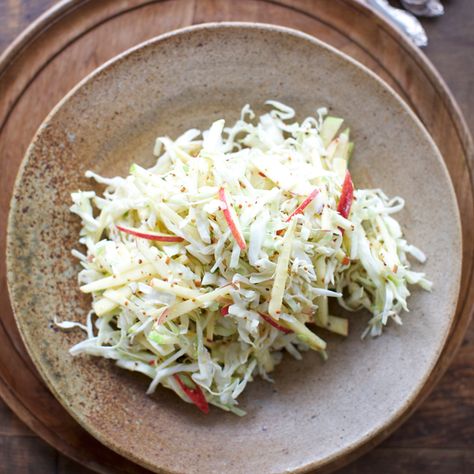 Green cabbage, tart apples and two kinds of mustard give this simple salad recipe plenty of interest, all in just 15 minutes. Apple Slaw Recipe, Kohlrabi Slaw, Jaime Oliver, Miso Ginger Dressing, Apple Slaw, Slaw Recipe, Vegetarian Cabbage, Slaw Recipes, Garlic Fries