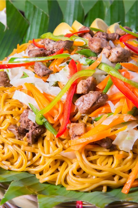 When you're in the tropical country of the Philippines, there's more to Filipino food beyond the famous adobo, sinigang, or sisig that are always at the top of lists on what to eat  – and that includes pancit. Pancit Canton Guisado, Pancit Guisado, Bihon Guisado, Bihon Recipe, Pancit Canton Recipe, Pancit Noodles, Guisado Recipe, Rice Sticks, Filipino Pancit