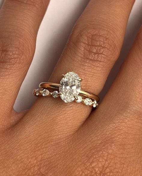 Aviva Ring with oval cut diamond paired with our Bella band Build your classic stack with us 💍 • • #engagementring #finejewelry #ringstack #bridal #diamond #weddingband #shesaidyes #ringinspiration Gold Wedding Band Oval Engagement Ring, Oval Ring With Wedding Band Gold, Gold Oval Engagement Ring With Wedding Band, Oval Wedding Ring And Band, Ring Stack Oval Diamond, Gold Wedding Band With Oval Engagement Ring, Oval Cut Engagement Ring Stack, Oval Solitaire Wedding Stack, Engagement Ring Stack Gold