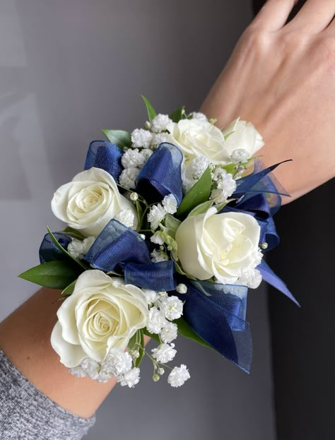 Wrist corsage and boutonniere pair of white spray roses, babies breath and navy blue ribbon. 

Orange Florist | Flower Delivery by The Dizzy Daisy
#thedizzydaisy #floral #bridal #weddings #weddingfloristOC #ocweddings #orangecountyweddings #orangecounty #bridalparty #bridesmaids #groom #groomsmen #weddingday #weddinginspiration #love #inlove #ido #weddingflowers #weddingideas #justmarried #chic #trends #elegant #beautiful #corsage #boutonniere #wristcorsage White And Navy Boutonniere, Corsage Navy Blue Dress, Navy Blue Prom Flowers Wrist Corsage, White And Navy Corsage, Corsage Prom Navy Blue, Prom Flowers For Blue Dress, Navy Blue And White Corsage, Navy Blue Prom Corsage, Royal Blue Corsage And Boutonniere Prom