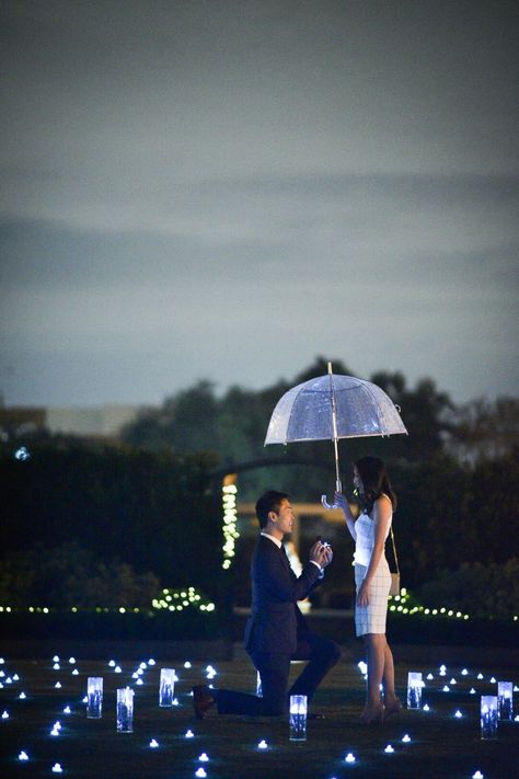 Most romantic proposal in the rain! #engagement #proposal #wedding #love #candles #romantic #tacori #taylorswift #domeumbrella Rain Proposal Ideas, Rain Proposal, Proposal In The Rain, Rainy Prenup Shoot, Pre Wedding Shoot In Rain, Clear Umbrella Couple Photography, Dome Umbrella, Cute Proposal Ideas, Morpheus Sandman