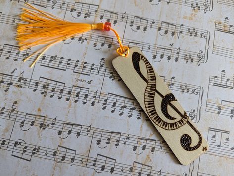 Embrace the symphony of music and literature with our wood burned bookmark. Order yours today and let the treble clef and piano design enchant your reading adventures, one page at a time. 🎵🎹 Piano Bookmark, Piano Design, Reading Adventure, How To Make Bookmarks, Treble Clef, Great Falls, Avid Reader, Pyrography, Book Accessories