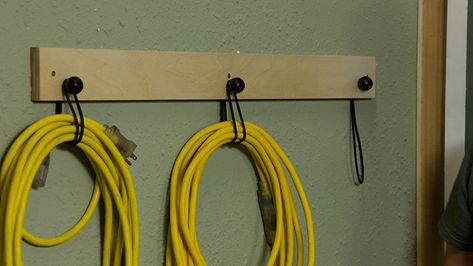 I store my extra hoses and extension cords on the wall, keeping them from devolving into a tangled mess. The system I use is easy to make and incorporates some found materials from around the shop. Extension Cord Storage, Small Parts Organizer, Small Storage Containers, Garage Workshop Organization, Tool Tips, Tool Storage Diy, Extension Cords, Table Saw Accessories, Storage Tips