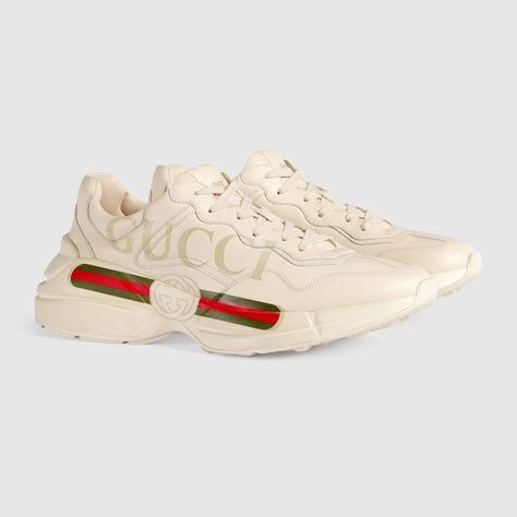 Shop the Rhyton Gucci logo leather sneaker by Gucci. Designed with a thick sole and bulky construction, the sneaker has a retro influence in leather with a vintage Gucci logo inspired by prints from the 1980s. Gucci Rhyton Sneakers, Tenis Gucci, Gucci Rhyton, Mens Sport Sneakers, Dad Shoe, Givenchy Tshirt, Louboutin Bags, Versace T Shirt, Gucci Vintage