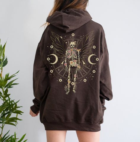 Fairy Grunge Aesthetic with Skeleton Butterfly Wings is a perfect gothic Fairycore hoodie for people who loves Witchcore and Fairywave. Add this cute and creepy y2k grunge fairycore design to your aesthetic clothes collection. Available on tshirt, sweatshirt and hoodies: https://www.etsy.com/shop/TheNims?search_query=fairy+grunge Browse through my other awesome items here: http://thenims.etsy.com/ ABOUT THE PRODUCT: Unisex Heavy Blend™ Hooded Sweatshirt | GILDAN 18500 (Customer Favorite) Everyon Creepy Y2k, Dark Fairy Aesthetic Clothes, Witch Aesthetic Clothes, Y2k Grunge Clothes, Fairycore Design, Hoodie Outfits Women, Grunge Hoodies, Skeleton Clothing, Fairy Skeleton