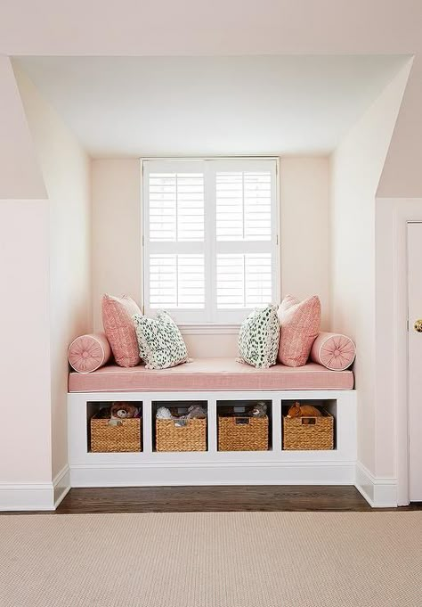 Pink girl's room features a nook filled with a built-in window seat fitted with open cubbies filled with woven baskets topped with a dusty pink linen cushion with white piping as well as matching bolster pillows, pink zigzag pillows in Quadrille Fabrics Petite Zig Zag and dalmatian print pillows in Thibaut Tanzania Fabric. Nursery Tips, Girl Nurseries, Built In Window Seat, Pink Girl Room, 아파트 인테리어, Window Seat, Small Space Living, Dream Bedroom, Nurseries