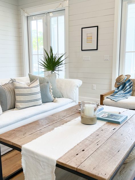 Coastal cottage in shades of white with blue accents. Decor by LINEN & SAND shop. Coastal Farmhouse Guest Room, Modern Coastal Throw Pillows, Coastal Throw Pillows Living Room, Southern Coastal Living Room, Coastal Couch Pillows, Coastal Farmhouse Living Room Ideas, House Decor Farmhouse Style, Coastal Basement, Blue Coastal Living Room