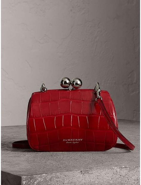 Burberry Small Alligator Frame Bag! A metal frame bag in glossy alligator skin with an oversized kiss-lock clasp. Detach the crossbody strap to carry it as a clutch. 19.5 x 7.5 x 14cm/7.7 x 3 x 5.5in Min. shoulder strap length: 50cm/19.7in Max. shoulder strap length: 60cm/23.6in Outer: 100% farmed alligator, alligator mississippiensis, country of origin: USA Inner: 100% lambskin. One interior slip pocket Kiss-lock clasp closure. Hand-painted edges. Printed Burberry lettering at front. Bags Online Shopping, Alligator Skin, Bowling Bags, Frame Bag, Burberry Handbags, Prada Handbags, Burberry Women, Fashion Mode, Black Cross Body Bag