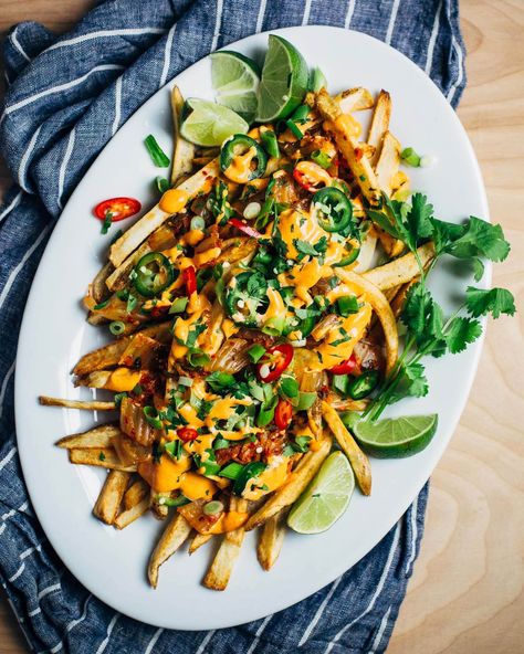 A recipe for irresistible kimchi fries layered with Sriracha mayo, fresh herbs, jalapeño, and spicy kimchi. Kimchi Fries, Homemade Fries, Kim Chi, Food Projects, Supper Recipes, Seasoning Recipes, Food 52, French Fries, Kimchi