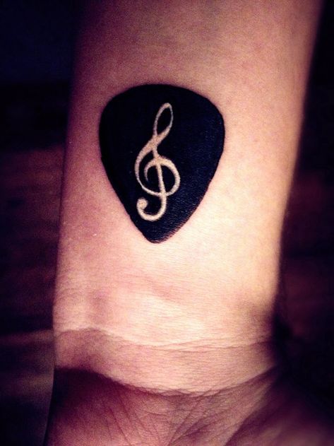 Guitar pick tattoo on wrist. I think I want Frankie's initials in the center. Guitarist Tattoo, Guitar Pick Tattoo, Pick Tattoo, Music Guitar Tattoo, Location Unknown, Music Note Tattoo, Key Tattoo, Black Guitar, Guitar Tattoo