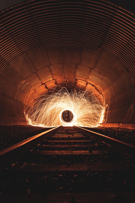 Creative steel wool photography on train tracks.. Download this photo by Andre Frueh on Unsplash Wool Photography, Steel Wool Photography, Creative Photography Ideas, Durga Picture, Light Painting Photography, Photography Ideas At Home, Fire Photography, Light Trails, Best Iphone Wallpapers