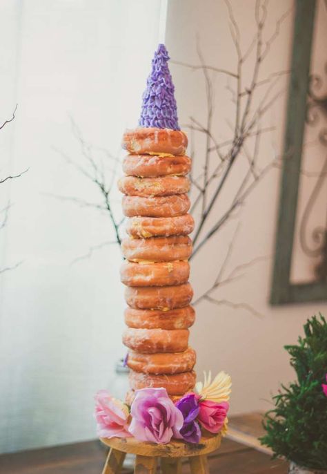 Cool donut tower at a Rapunzel birthday party! See more party planning ideas at CatchMyParty.com! Tangled Birthday Party Games, Rapunzel Bday Party, Tangled Party Food, Tangled Themed Birthday Party, Rapunzel Themed Birthday Party, Rapunzel Birthday Party Ideas, Tangled Rapunzel Birthday Party, Tangled Birthday Cake, Donut Tower