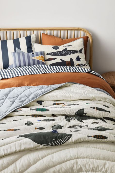 Dive into deep-sea fun with our Shark School Quilt in cool, modern shades of soft blue-black and white with pops of color. Crafted of organic cotton, the quilt features a friendly crew of sharks and fish with embroidered details and a coordinating pale blue border that continues on the reverse side. Pair this playful layer with other pieces from our exclusive Shark School collection.   • 100% organic cotton shell, grown without chemicals or pesticides  • 100% recycled polyester fill  • This item Modern Nursery Boy, Boy Fishing Room, Boys Ocean Themed Bedroom, Fishing Themed Boys Bedroom, Striped Pillow, Kid Bedding, Ocean Toddler Room, Space Themed Kids Room, Toddler Bedding Boy