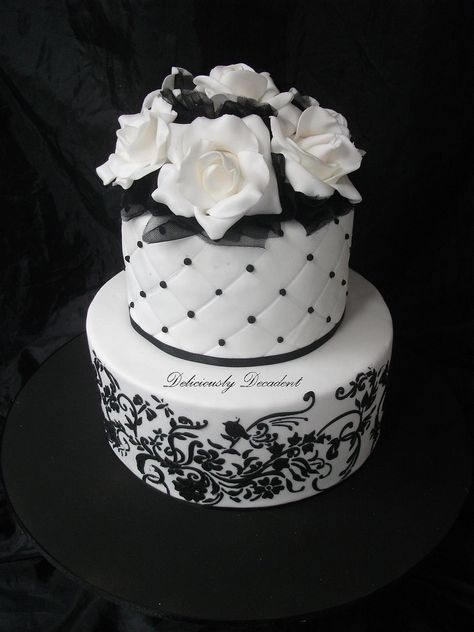 Black and White Cake with stencil work and pearls, gumpaste roses and black tulle in gaps Cake With Black Flowers, White Cake With Black, Black White Cakes, Stencil Cake, Sweet Sixteen Cakes, White Birthday Cakes, White Cakes, 40th Birthday Cakes, 50th Birthday Cake