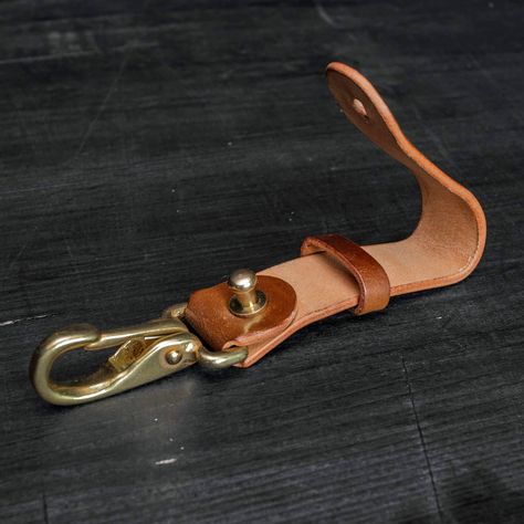 Leather belt loop for keys made of Shell Cordovan, Horween USA leather. Leather ±1.8-2mm / 4.5-5oz thickness. Loop is made to be used on standart 1 1/2 inch (38mm) belt Width: 20mm The edges carefully polished. Solid brass snap hook and pin head screw. Could make in reversed shell (add a note for this) PROCESSING TIME All crafts are made to order, by colors you have chosen. Time of dispatch depends on orders sequence in current time. Usually it will be done within 1-3weeks, but in very busy peri Leather Belt Key Holder, Belt Key Holder, Leather Knife Sheath Pattern, Leather Working Projects, Leather Fob, All Crafts, Pin Head, Diy Leather Projects, Leather Wallet Pattern