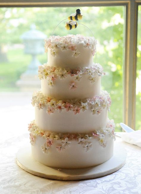 Four-tiered spring-inspired wedding cake with white fondant, pastel fondant flowers and twin bumble bee cake toppers Bee Wedding Theme, Bee Wedding Cake, Bumble Bee Cake, Blue Wedding Decorations, Floral Cakes, Pretty Wedding Cakes, Bee Wedding, Photography Cake, Bee Cakes