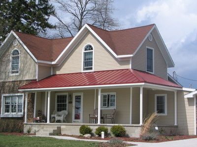 CMG’s steel coil in Colonial Red was used to complete this project. Colonial Red has an Ultra-Cool Rating of 33.2% for reflectivity and .86 for emissivity. It has an SRI rating of 35. In 24ga, Colonial Red comes with a 35 year finish warranty. In... Read More Beige House Exterior Red Roof, Red Metal Roof House Colors, Red Metal Roof Houses, Roof Paint Colors, Red Metal Roof Houses Color Combos, Red Roof House Colors Colour Schemes, Red Roof House Colors Home Exteriors, Red Roof House Colors, Red Metal Roof