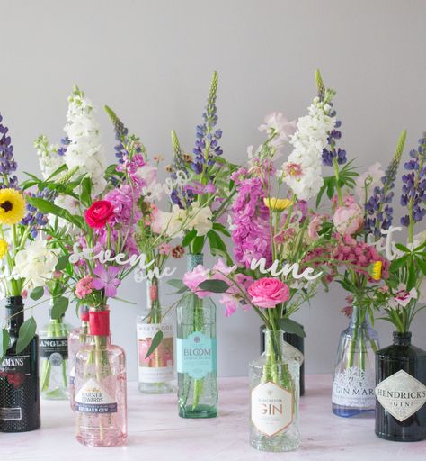 Wedding Table Decorations Gin Bottles, Wedding Decor Bottles, Flowers In Wine Bottles Wedding, Gin Table Wedding, Gin Bottle Table Decorations, Flowers In Gin Bottles, Gin Bottle Flowers Wedding, Flowers In Bottles Wedding, Wedding Table Centerpieces Gin Bottles