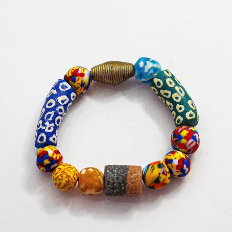 What a striking combination! I love the mix of Krobo, African sandcast and Clay bead colors. Krobo Glass Beads : Handmade in Ghana using grounded recycled glass. Glass is finely grounded, molded and baked. Select beads are then individually hand painted using ceramic paint. This bracelet is a one-of-a-kind artisan piece of jewelry that will bring vibrance and intrigue to your look. Price: 10000 African Bracelets, Handmade African, Clay Bead, African Beads, Beads Handmade, Love Bracelets, Recycled Glass, Clay Beads, Number 1