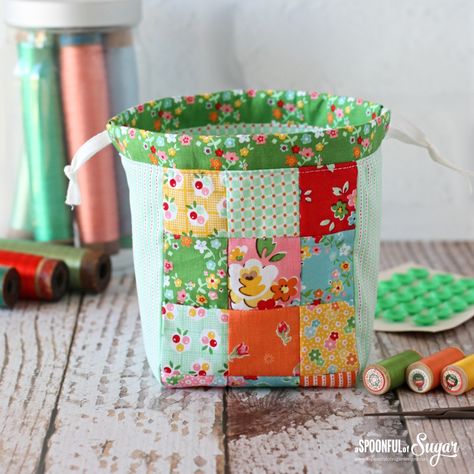 Showcase your favourite fabrics in this patchwork handy drawstring bag. The pdf pattern sewing pattern is perfect for beginners and is a fun afternoon project. Lined Drawstring Bag Tutorial, Drawstring Bag Tutorials, A Spoonful Of Sugar, Patchwork Purse, Nine Patch, Pouch Pattern, Bag Patterns To Sew, Drawstring Bags, Drawstring Pouch