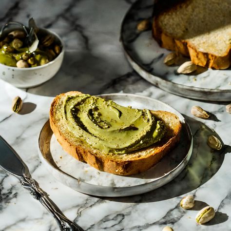 Feeling snacky? Here's the fix! 😋 Grab a slice of sourdough bread and spread on our yummy Pistachio Butter That's it – you're set! Enjoy the creamy, nutty goodness of our Pistachio Butter Toast. It's a snack-time winner! 🌟🍞 Simple, tasty, and oh-so-satisfying! #SnackTime #PistachioPower #pistachio #pistachiodessert #pistachio #pistachios #pistachiobutter Pistachio Dessert, Butter Toast, Pistachio Butter, Dubai Style, Products Photography, Sourdough Bread, Snack Time, Pistachio, Product Photography