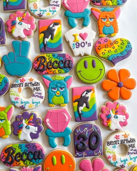 Kellie Bakes & Co. on Instagram: "I ❤️ the 90’s babyyyy 🐬🌈✨ I will take any chance I get to make a furby cookie!!! #lisafrankcookies #90scookies #rainbowcookies #retrocookies #furbycookies #cheetahcookies #lisafrank #mixtapecookies #smileycookies #ringpopcookies #unicorncookies #sugarcookies #sugarcookiesofinstagram #decoratedsugarcookies #michiganbaker #bakersofig #royalicing #royalicingcookies #royalicingart #cutoutcookie #monroemichigan #cookiesofinstagram #cookies #baking #bakestagram #Mi 1993 Birthday Cookies, 90s Theme 1st Birthday Party, Y2k Cookies Decorated, 90s Decorated Cookies, Lisa Frank Cookies Decorated, Furby Birthday Party Ideas, 90s Sugar Cookies, Bratz Cookies, 90s First Birthday Party