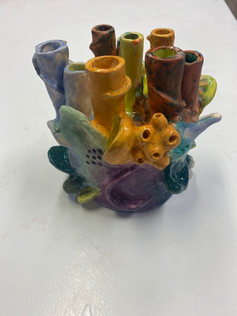 Ceramic sculpture inspired by biomorphism and coral reefs. Textured glaze and underglaze applied on the piece. The cylinders can have candles placed on them, and them can be flipped and support the shape of the piece, exposing a bowl underneath the sculpture. #ceramicstudio #ceramics #ceramicschool #ceramicartist #clay #glaze #artschool #aesthetic #art #artist #stoneware #earthenware #ceramicsofinstagram #ceramicsofpinterest Biomorphic Ceramics, Ceramic Coral Reefs, Clay Coral, Biomorphic Art, Ceramic Coral, Clay Glaze, Ceramics Ideas, Coral Reefs, Arts Ed