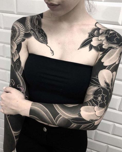 black-top-white-brick-wall-arm-tattoo-ideas-both-arms-tattooed-snake-flowers Eboy Tatts, Tattooed Lady, Gang Tattoos, Sleeve Tattoos For Men, Solid Black Tattoo, Tattoos For Men And Women, White Tattoos, Blackout Tattoo, Lucy Lawless