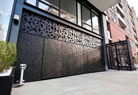 Parc Lofts | Metal Doors // remote controlled steel parking garage doors and gates with custom CNC cut leaf pattern and powder coat finish make a grand impression at this new condo project // Commercial Design Decorative Panels Architects Alliance Door Parking, Fence Modern, Wood Fence Design, Gate Wall Design, Gate Designs Modern, Gates Design, Modern Fence Design, Metal Doors Design, Steel Door Design