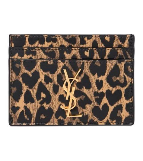 Saint Laurent - Monogram leather card holder - Make every transaction a stylish one with this leopard-print card holder from Saint Laurent. Made from supple leather, the slender style has four card slots, one larger slip pocket, and features the maison's iconic monogram logo in golden metal. seen @ www.mytheresa.com Ysl Cardholder, Ysl Card Holder, Ysl Wallet, Cute Wallets, Leather Card Holder, Birthday Wishlist, Pretty Bags, Monogrammed Leather, Leopards