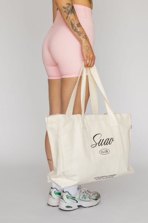 Perfect for everyday use to hold anything from your sneakers to your gym outfits. It's designed with compartments for you to organize your essentials. Our oversized tote bag is crafted from cotton canvas and is designed with a SUAV Club screen-printed logo. *Please note that no promo code can be used on this product. Active Wear Photoshoot, Gym Tote, Oversized Tote Bag, Gym Outfits, Oversized Tote, Small Tote Bag, Website Content, Bags Logo, Un Logo