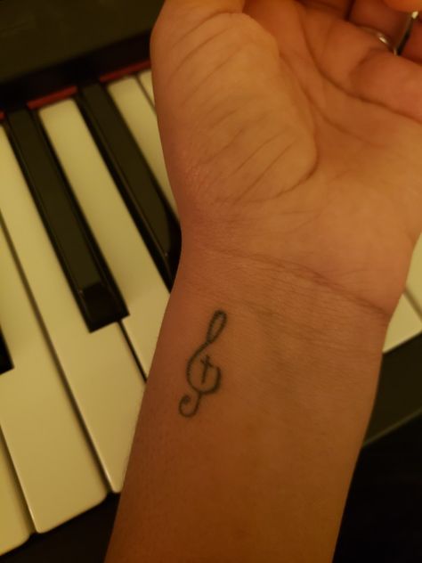 treble clef with cross, christian, jesus, music, piano, tattoo, minimalist, simple Music Aesthetic Tattoo Ideas, Tiny Piano Tattoo, Music Minimalist Tattoo, Piano Related Tattoo, Music Tattoo Simple, Christian Music Tattoo, Music Best Friend Tattoos, Piano Tattoo Ideas, Small Music Note Tattoo For Women