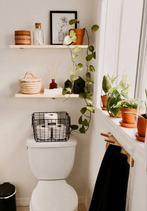 18 Bathroom Shelf Decor Ideas For Over The Toilet That Look Amazing Boho Small Apartment Decor, Simple Boho Bathroom Decor, Small Bathroom Ideas Shower Curtain, Simple Boho Bathroom, Budget-friendly Home Decor Ideas, Aesthetic Bathroom Organization, Bathroom Decor Small Space, Bathroom Refresh On A Budget, Apartment Decorating Bathroom