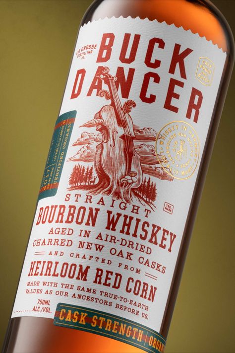 Buck Dancer's packaging takes its visual inspiration from the Heirloom Red Corn that it's meticulously crafted with. Designed by Chad Michael Studio, the label exudes the same vitality of Wisconsin's native lands, visualized with rustic undertones and refined details. When design can envision the same philosophy that a brand stands by, the packaging system shines, and Chad Michael Studio has done just that with Buck Dancer's meticulously crafted label. Spirits Packaging Design, Whiskey Packaging, Bourbon Brands, Packaging System, Whiskey Label, Whiskey Brands, Label Shapes, Bottle Design Packaging, Alcohol Packaging