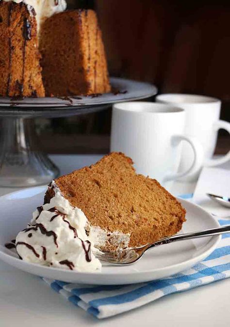 Coffee flavoured Cappuccino Angel Food Cake, is topped with lots of sweet whipped cream and a drizzle of dark chocolate sauce! Flavored Angel Food Cake, Dark Chocolate Sauce, Cappuccino Cake, Sweet Whipped Cream, Out Magazine, Vanilla Coffee, Angel Food Cake, Fair Food Recipes, Food Cake