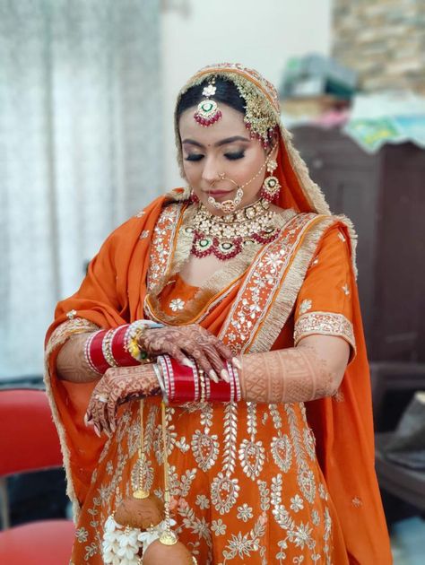 A typical punjabi bridal look in burnt orange colour Punjabi Bridal Look, Orange Suit, Punjabi Bride, Traditional Bride, Orange Colour, Punjabi Suit, Sikh Wedding, Burnt Orange Color, Bridal Look