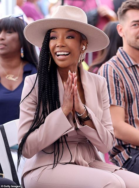 Fellow singer: Brandy Norwood, 43, chose a mauve suit with a belted jacket and matching mauve fedora to support her friend, who cut the record In These Streets Outfits With Fedora Hats, Mauve Suit, L Shaped Couches, Outfit With Fedora, Fedora Outfit, Fedora Hat Outfits, Types Of Hats For Women, Brandy Norwood, Coral Outfit