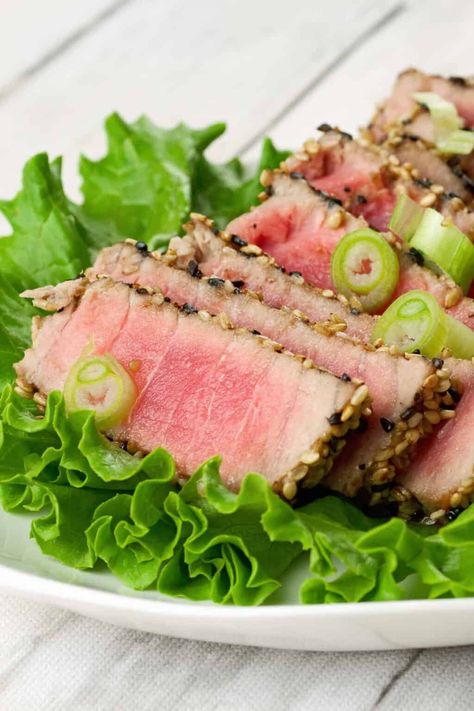 Pan-seared tuna steaks crusted with sesame seeds is a restaurant treat that is so easy to make at home you may never order it out again. Pan Seared Tuna Steak, Sesame Crusted Tuna, Seared Tuna Steaks, Ahi Tuna Steak, Tuna Steak Recipes, Tuna Steak, Seared Ahi, Seared Tuna, Sous Vide Recipes