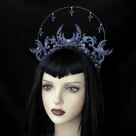 Andromeda (Limited edition) Beautiful halo style galaxy themed crown, with a central laarge moon, filigree swirls and a halo of twinkling stars. Painted in aa brushed galaxy colour effect and finished with a mix of ab purple rhinestones. Handmade to order, ready in around 3 weeks. May take longer during busy times. Perfect for alternative outfits, bridal photoshoots, gothic wedding, alt events and more. ------------------------------------------------- Headwear Guide -Headwear comes in one size Moon Halo Crown, Moon Witch Costume, Moon Headdress, Space Crown, Moon Headpiece, Space Cosplay, Alternative Photoshoot, Star Witch, Moon Halo