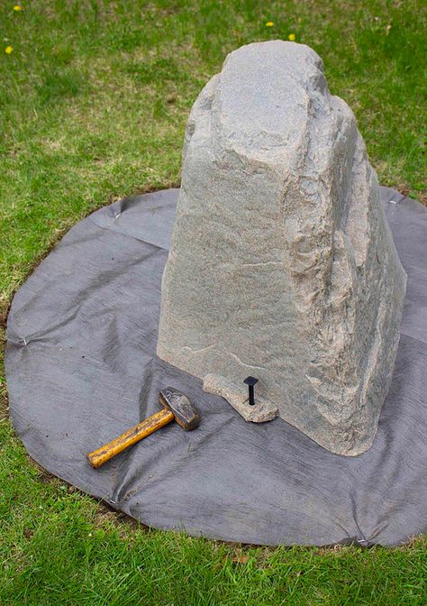 An anchor stake sticking out of a Dekorra rock enclosure that is covering a wellhead. Fake Rock, Faux Rock, Rock Cover, Front Yards, Dream Pools, Front Lawn, Landscape Fabric, Cover Ideas, Natural Rock