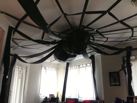 Giant spider Halloween party decoration | Manning Makes Stuff Halloween Ceiling Fan, Halloween Office Ideas, Halloween Ceiling Decorations, Halloween Ceiling, Ceiling Paper, Huge Spiders, Halloween Office, Spider Decorations, Dance Rooms