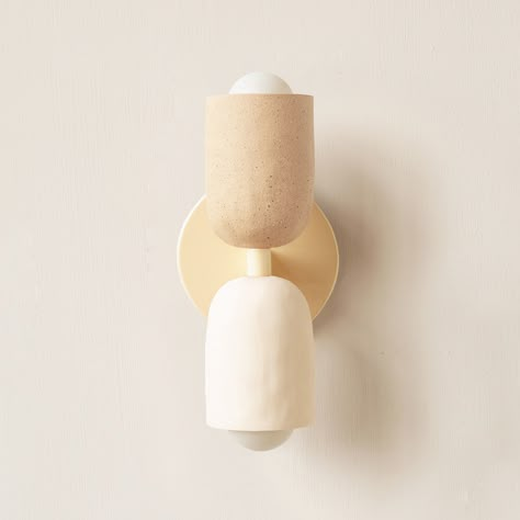 The petite and unobtrusive Ceramic Up Down Wall Sconce emits a soft glow both up and down the wall. Available in 175 different combinations. Each ceramic shade is handmade and left raw or pigmented.Please select a canopy finish, an upper shade color, and a lower shade color. Limewash Plaster, Dining Room Wall Design, Japandi Lighting, Lauren Butler, Bedside Pendant Lights, Blackened Steel, Bathroom Sconces, Primary Bathroom, Recessed Ceiling